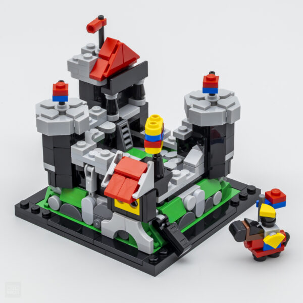 Miniature château médiéval construit avec des briques LEGO, coloré et détaillé, parfait pour collection ou jeu créatif.